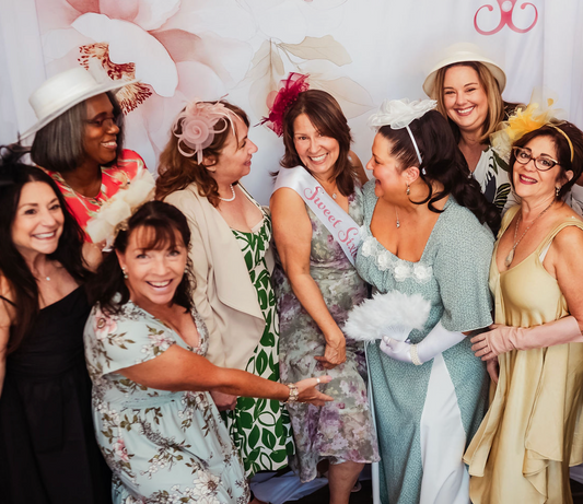 sweet sixtee birthday party at tea house, fun group of women celebrating a sixtieth birthday party wearing hats, sweet sixtee birthday sash, sweet sixtee photo backdrop